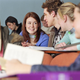 Captured Girls Gone Wild in a simulated classroom setting, where tracking collars that emit a slight shock are used to curb the girls' instinct to jump up on desks and remove their tops.